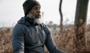 Holistic Divinity - SOUL - black man in park meditating