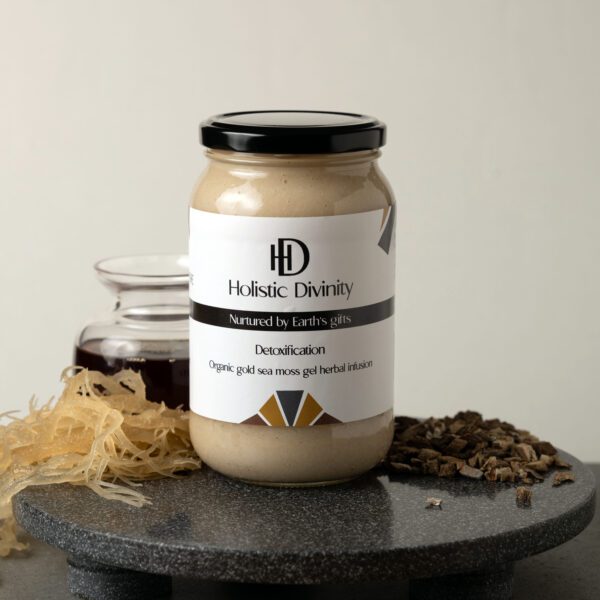 Detoxification | Organic Gold Sea Moss Gel Herbal Infusion | 550ml | Jar on dark marble slab with gold seamoss, black seed oil, burdock root, alkaline