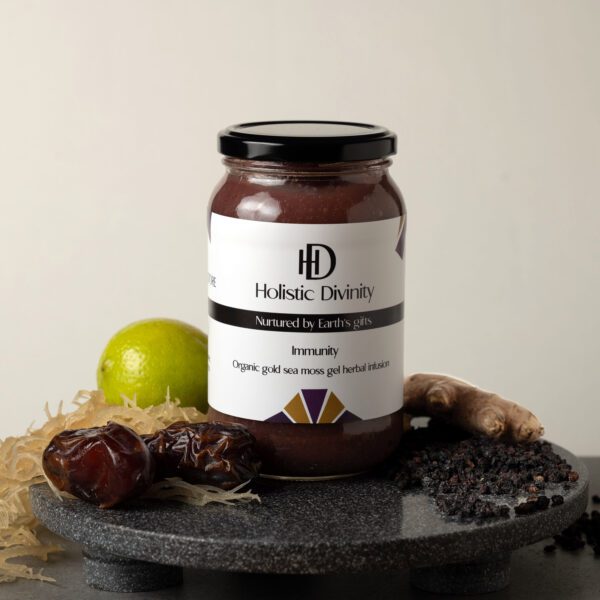 Immunity | Organic Gold Sea Moss Gel Herbal Infusion | 550ml | Jar on dark marble slab with gold seamoss, lime, dates, elderberry, elderberries, ginger, alkaline