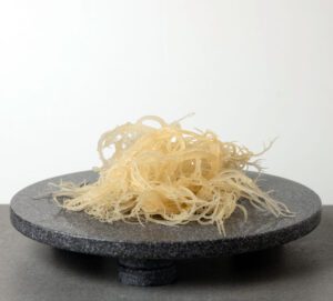 Golden Treasure | Organic Gold Sea Moss Gel | Holistic Divinity | Sea moss on dark marble slab